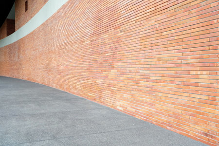 Red Curved Brick Wall and Hallway.の写真素材
