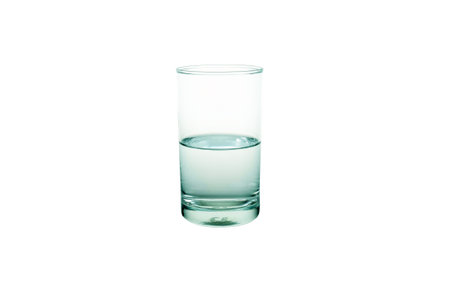 Half Water in Glass Isolated on White Background.の写真素材