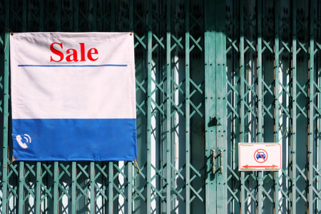 Sale Sign of Commercial Building on Folding Door.