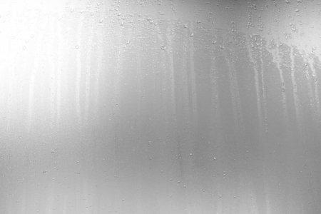 Raindrop on White Grunge Frosted Glass Background.の写真素材