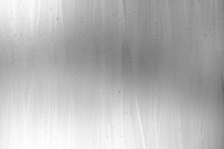 Raindrop on White Grunge Frosted Glass Background.の写真素材