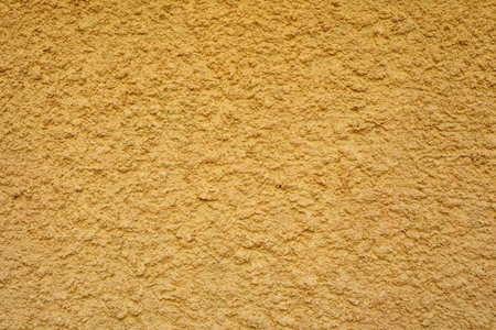 Yellow Stucco Wall Texture Background.