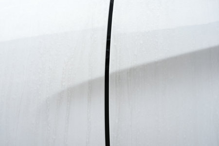 Water Stains and Dust on White Surface of Car Body, Suitable for Car Care Concept.の写真素材
