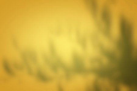 Abstract Gold Gradient of Leaves Shadow on Wall Background.
