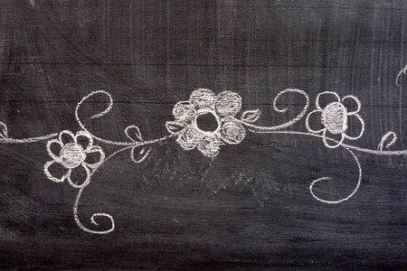 Flower Hand Drawing in Doodle Style on Chalkboard.の写真素材