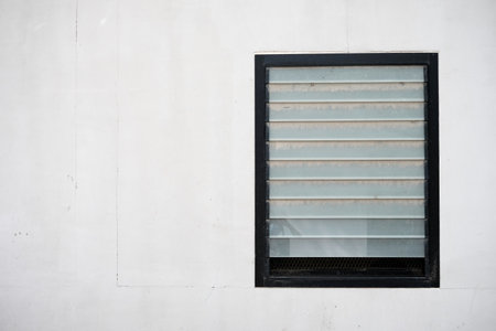Old Louver or Window Blind with White Wall Background.の写真素材