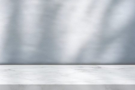 White Marble Table with Tree Shadow on Concrete Wall Texture Background, Suitable for Product Presentation Backdrop, Display, and Mock up.の写真素材