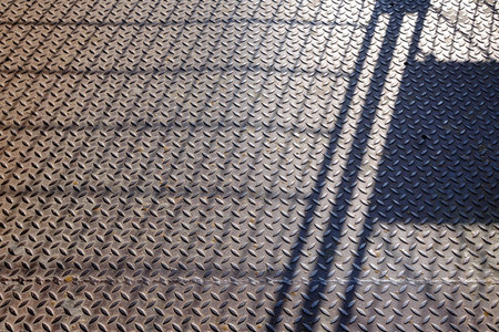 Shadow Fence on Metal Diamond Floor.