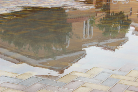 villa shadow on rain waterの写真素材