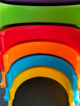 Multicolored plastic dowels on a black background close-upの写真素材