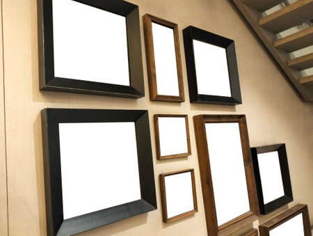 Blank picture frames hanging on the wall with copy space for textの写真素材