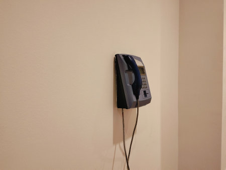 telephone on the wall of a room, closeup of photo