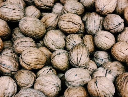 Background of walnuts in the market, closeup of photo.
