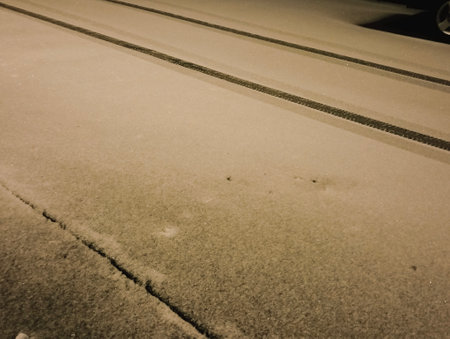 Tram tracks in the snow, close-up. Toned.の写真素材