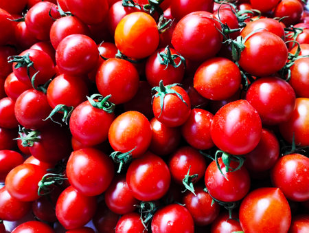 Fresh red cherry tomatoes background. Red tomatoes background. Top view.の写真素材