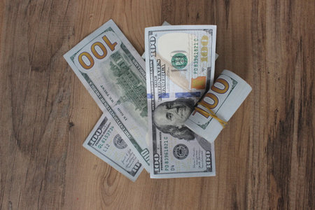 dollars on wooden background, money background, us dollar banknotes