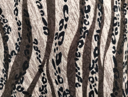 texture, background, pattern. Fabric with a print of zebra skin.