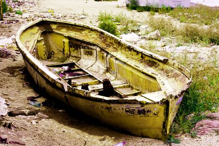 old boat on old coast の写真素材