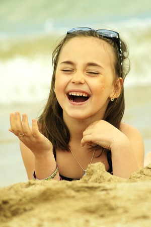 Happy girl on a beachの写真素材