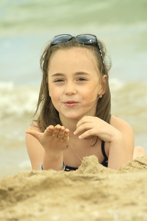 Happy girl send kiss from the beachの写真素材