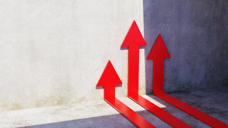 Red arrow pointing up with concrete backgroundの写真素材
