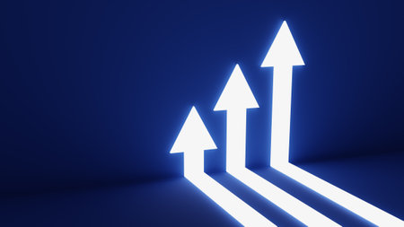 Three white arrows pointing up with a blue backgroundの写真素材