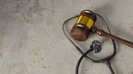 Medical dispute concept background with courtroom gavel and stethoscope, 3d renderingの写真素材