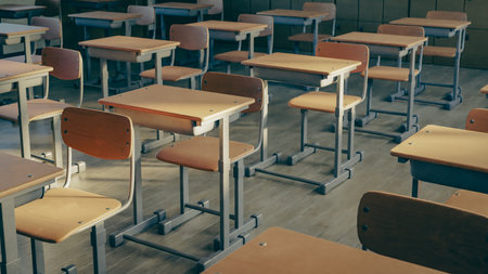 Empty school classroom desks and chairs, 3d renderingの写真素材