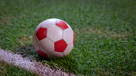 Football (Soccer) on field grass close-up background, 3d renderingの写真素材