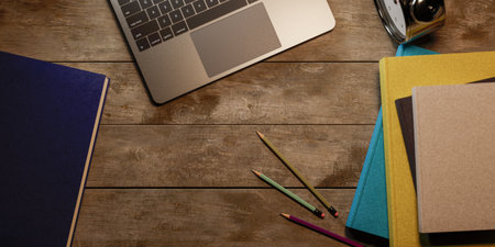 Top view on the desk with a stack of books with a concept of studying for the school exam, 3d renderingの写真素材