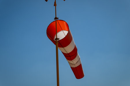 striped wind vane to measure wind at the airportの写真素材