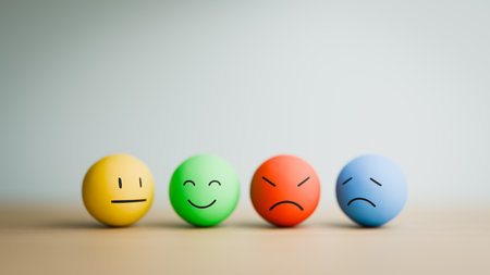 Four Diverse Emoji Face Spheres Expressing Emotions Copy Space. 3d rendering
