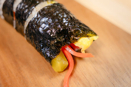 Korean gimbap roll end piece showing filling with copy space