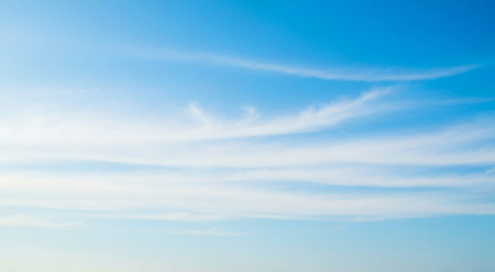 blue sky background,clouds in the blue sky.blue sky background with tiny cloudsの素材