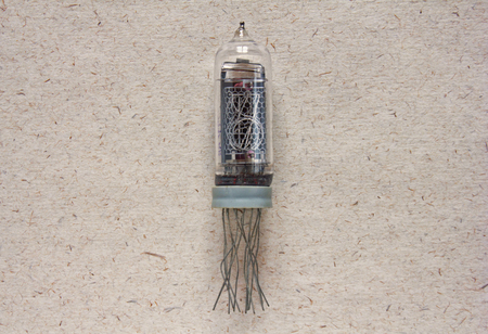 Close-up view of vintage nixie tube indicator of the numbers on craft paper backgroundの写真素材