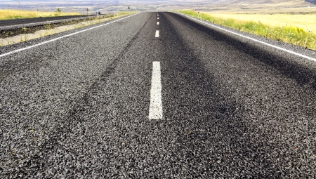 highway in steppe ,long road stretching out into the distance の写真素材