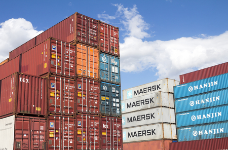 Cargo freight containers stacked in the storage area of â€‹â€‹the river port terminal