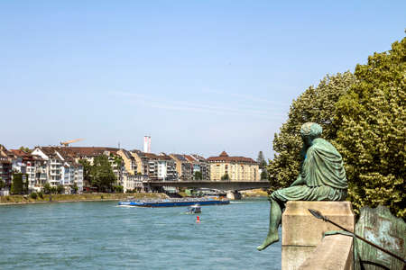 Basel, SWITZERLAND : Sitting Helvetia statue on the river Rhine in Basel, Switzerlandのeditorial素材