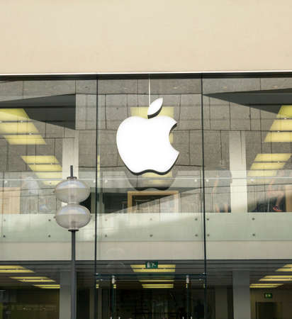 Munich, GERMANY : APPLE store and logo. Apple Inc. is an American multinational technology company...