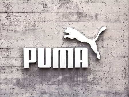 Herzogenaurach, Germany : Puma logo on a facade. Puma is a major german multinational company that produces athletic, casual footwear, sportswear, headquartered in Bavaria, Germanyのeditorial素材