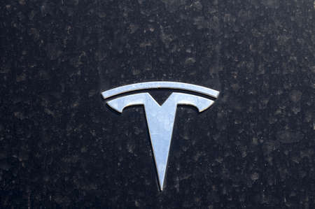 Tesla Motors automobile sign. Tesla Motors, Inc. is an American automotive and energy storage...