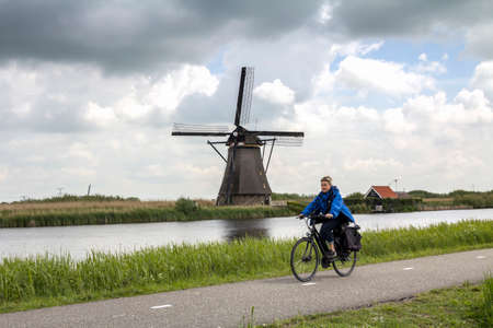 Netherlands rural lanscape with windmills at famous tourist site Kinderdijk, Rotterdam, in Holland. Old Dutch village Kinderdijk, UNESCO world heritage site.のeditorial素材