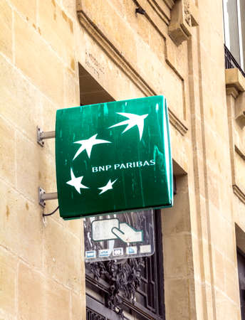 Le Havre, France: Sign outside a branch of the BNP Paribas Bank. Formed through merger in 2000, BNP Paribas is very large French global banking group, which has its headquarters in Parisのeditorial素材