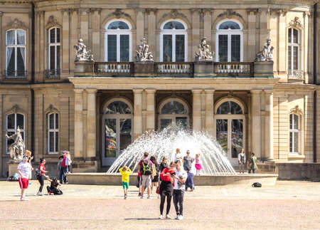 STUTTGART - Apr 20, 2019: The New Palace - Neues Schloss is a beautiful building located in Schlossplatz, the central square. This is a perfect place for locals and tourists relaxation.のeditorial素材