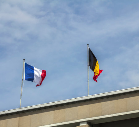 French and German flags waving against of skyの写真素材