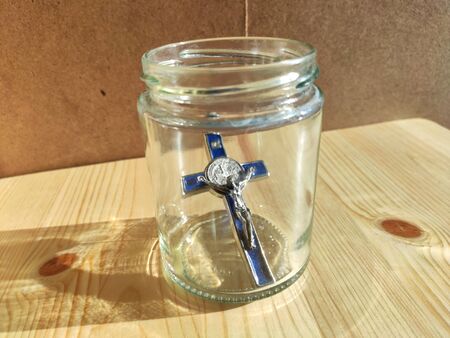 Vatican cross with Jesus Christ in a transparent jarの写真素材