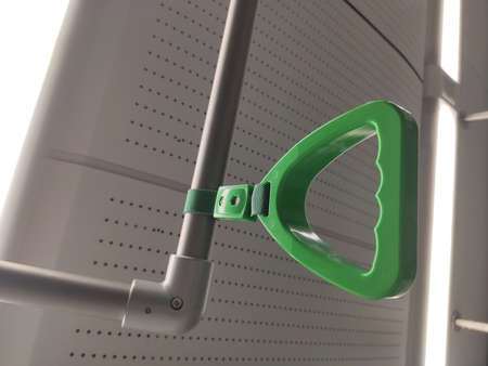 Green safety grab handle in a trainの写真素材
