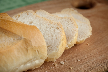 Slices of bread on a wooden chopping board