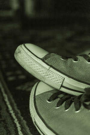 A closeup picture of a pair of sneakers in tinted monochromeの写真素材