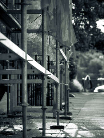 A tinted monochromatic image of scaffolding structure
